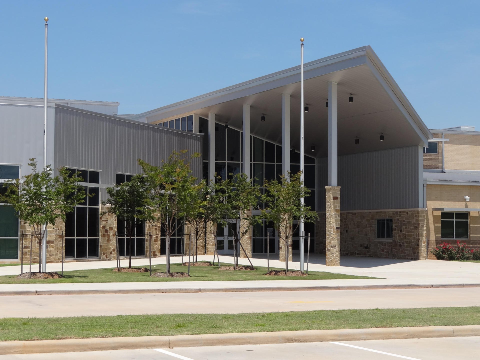 Montgomery ISD – Oak Hills Junior High School & Keenan Elementary SchoolMontgomery ISD’s Oak Hills Middle School & Keenan Elementary School were built concurrently. The 214,182 SF, two-story middle school and 96,000 SF, single story elementary school are located on a common site. The 64 acre site is located on sloping terrain which required vertical modifications of existing elevations by 18’ to properly situate the building structures and site appurtenances. In addition to the building structures, the scope of work includes a football field, running track, field events, practice athletic fields, concession stands, site paving and detention pond. The building construction elements include a structurally suspended slab, Class A steel framing, masonry load bearing walls, exterior masonry veneer and standing seem metal roofing.Back to Portfolio