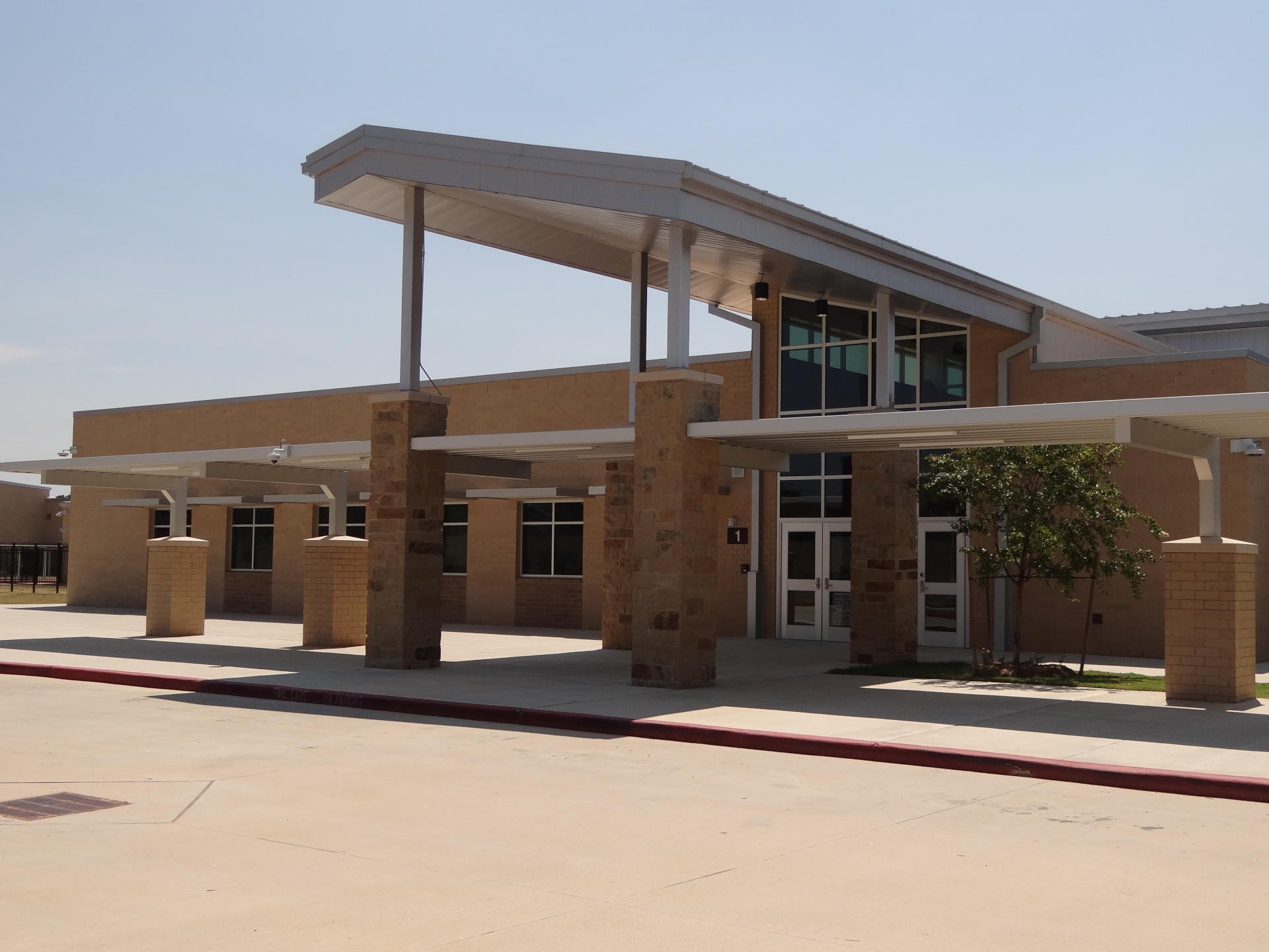 Montgomery ISD – Oak Hills Junior High School & Keenan Elementary SchoolMontgomery ISD’s Oak Hills Middle School & Keenan Elementary School were built concurrently. The 214,182 SF, two-story middle school and 96,000 SF, single story elementary school are located on a common site. The 64 acre site is located on sloping terrain which required vertical modifications of existing elevations by 18’ to properly situate the building structures and site appurtenances. In addition to the building structures, the scope of work includes a football field, running track, field events, practice athletic fields, concession stands, site paving and detention pond. The building construction elements include a structurally suspended slab, Class A steel framing, masonry load bearing walls, exterior masonry veneer and standing seem metal roofing.Back to Portfolio